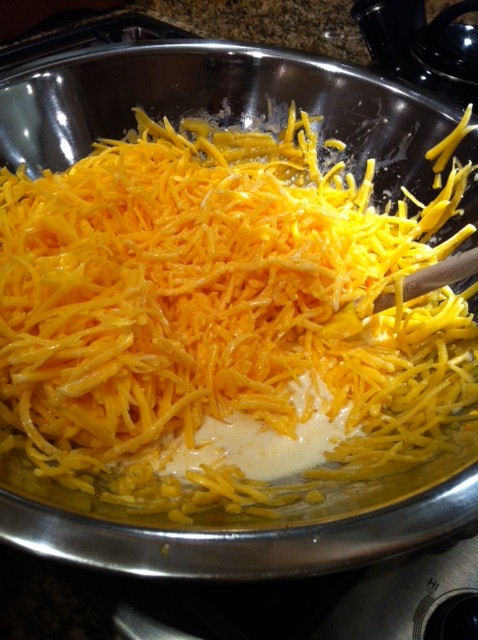 Melt the cheese and milk on a double boiler...stir, stir, stir!