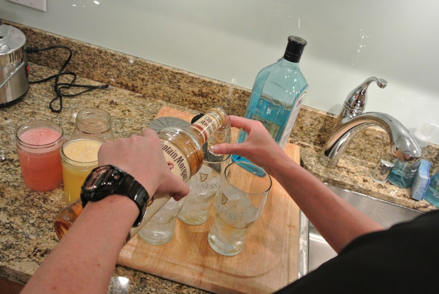 Adding spiced rum...since we did not have lite rum...worked out anyways :)