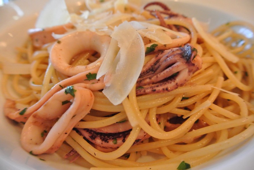 Add shaved Parmesan reggiano to the dish. 