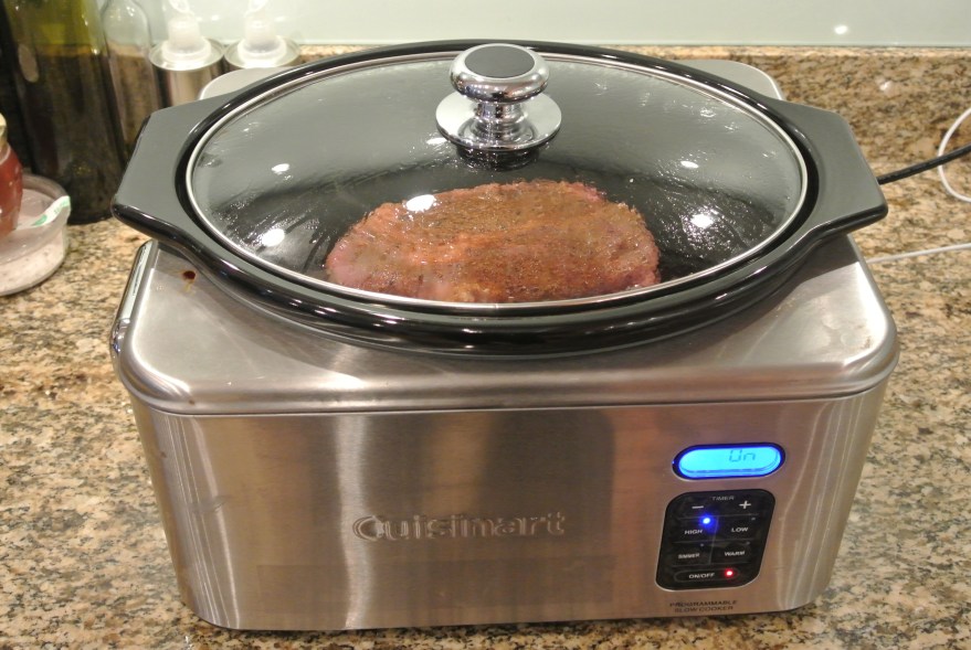 Cover all sides of the chuck roast with the seasonings and place in the slow cooker.  Ours is a cuisinart slow cooker
